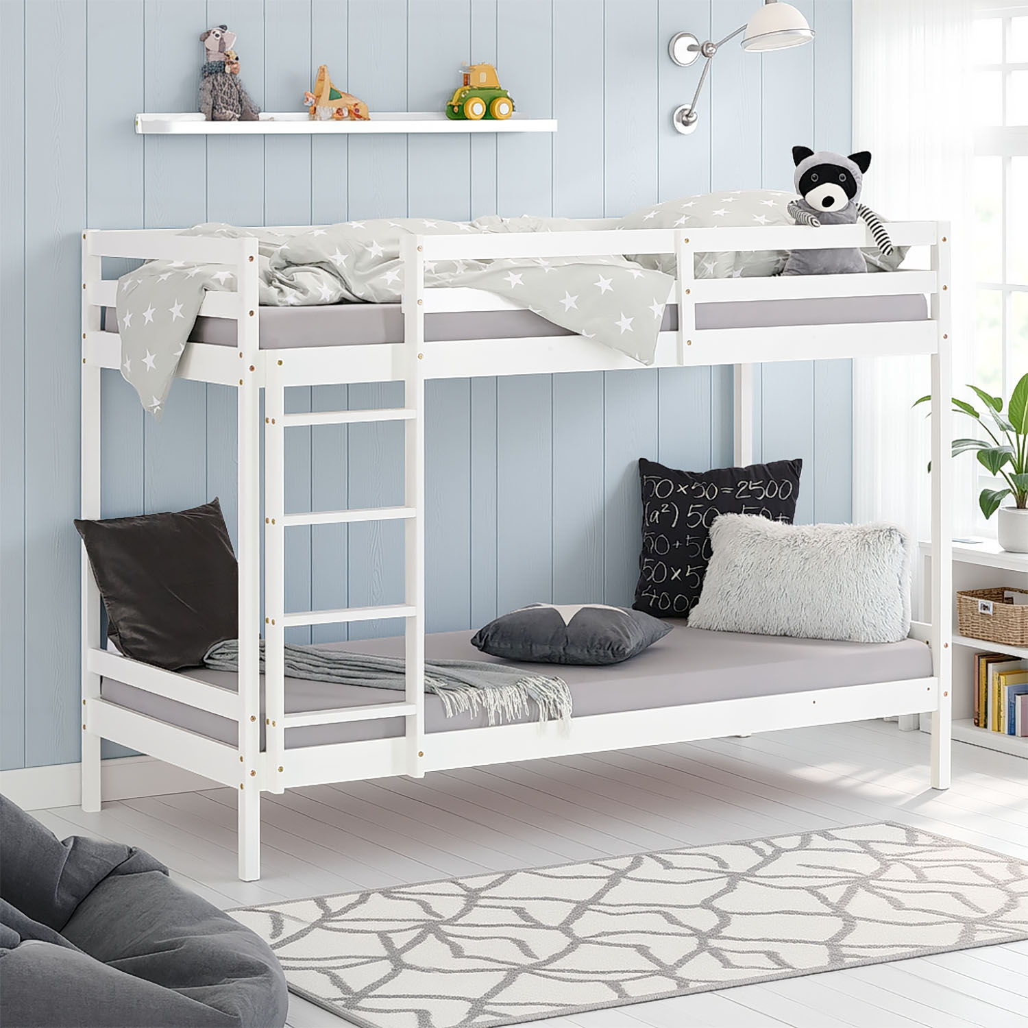 Modern children's room with white wooden bunk bed, cozy cushions, and decorative pennant garland under a sloped ceiling ? stylish and space-saving sleeping solution.