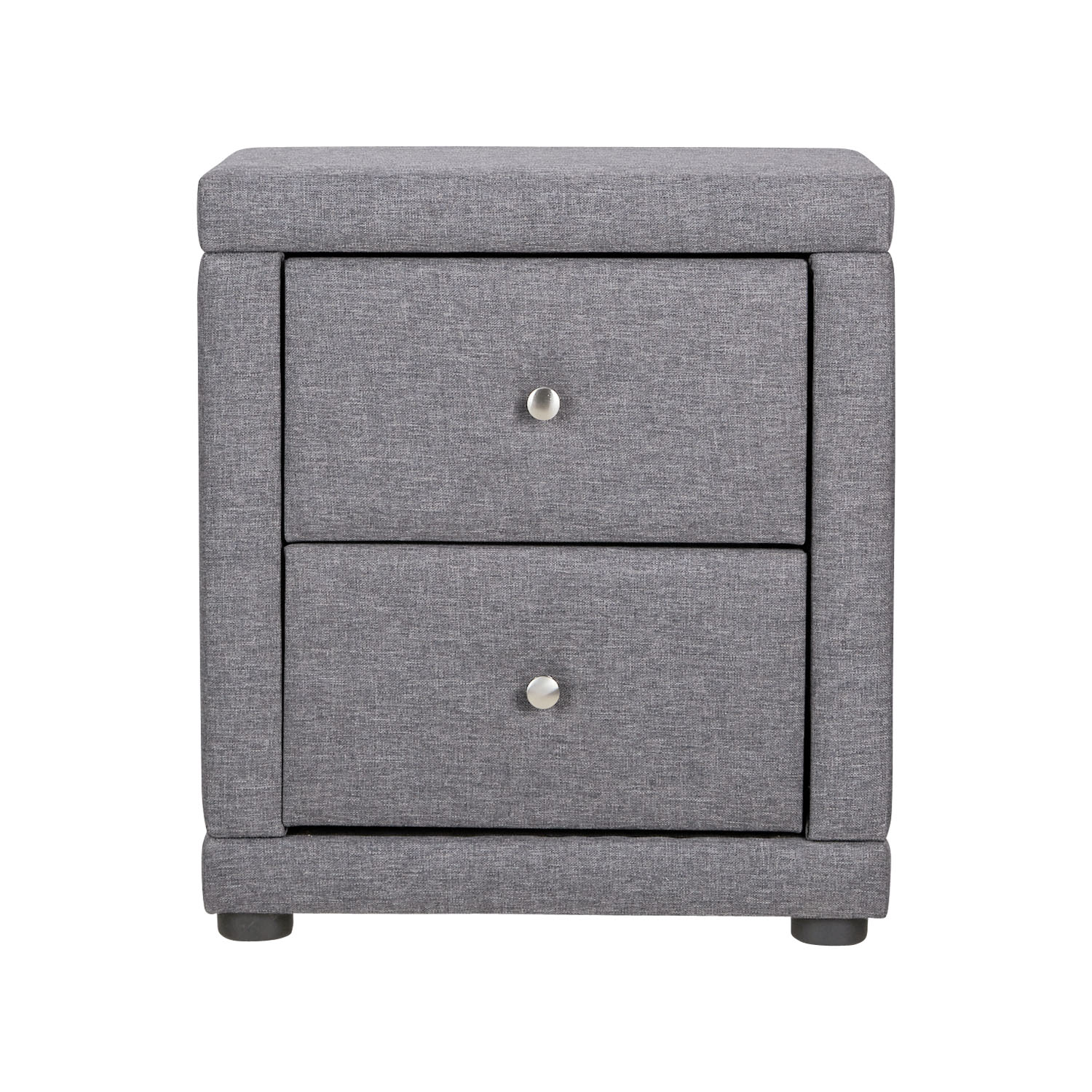 Two-drawer bedside table fully upholstered in dark grey fabric, featuring silver knob handles, placed next to an upholstered bed with a vertical wooden panel behind and a framed photo on top.