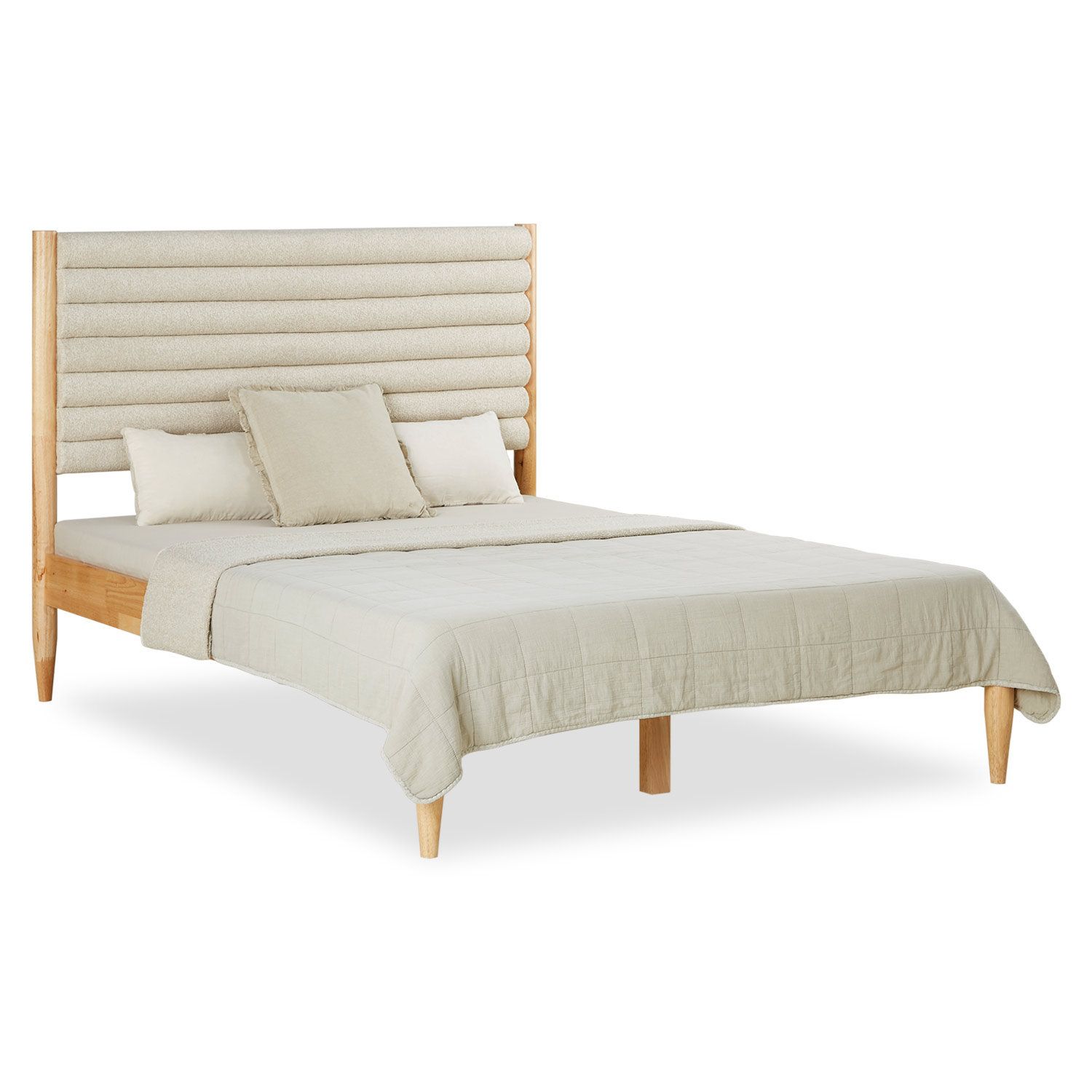 Bed with a distinctive, horizontally upholstered headboard in light fabric and light wood frame, dressed in beige bedding and decorative pillows.